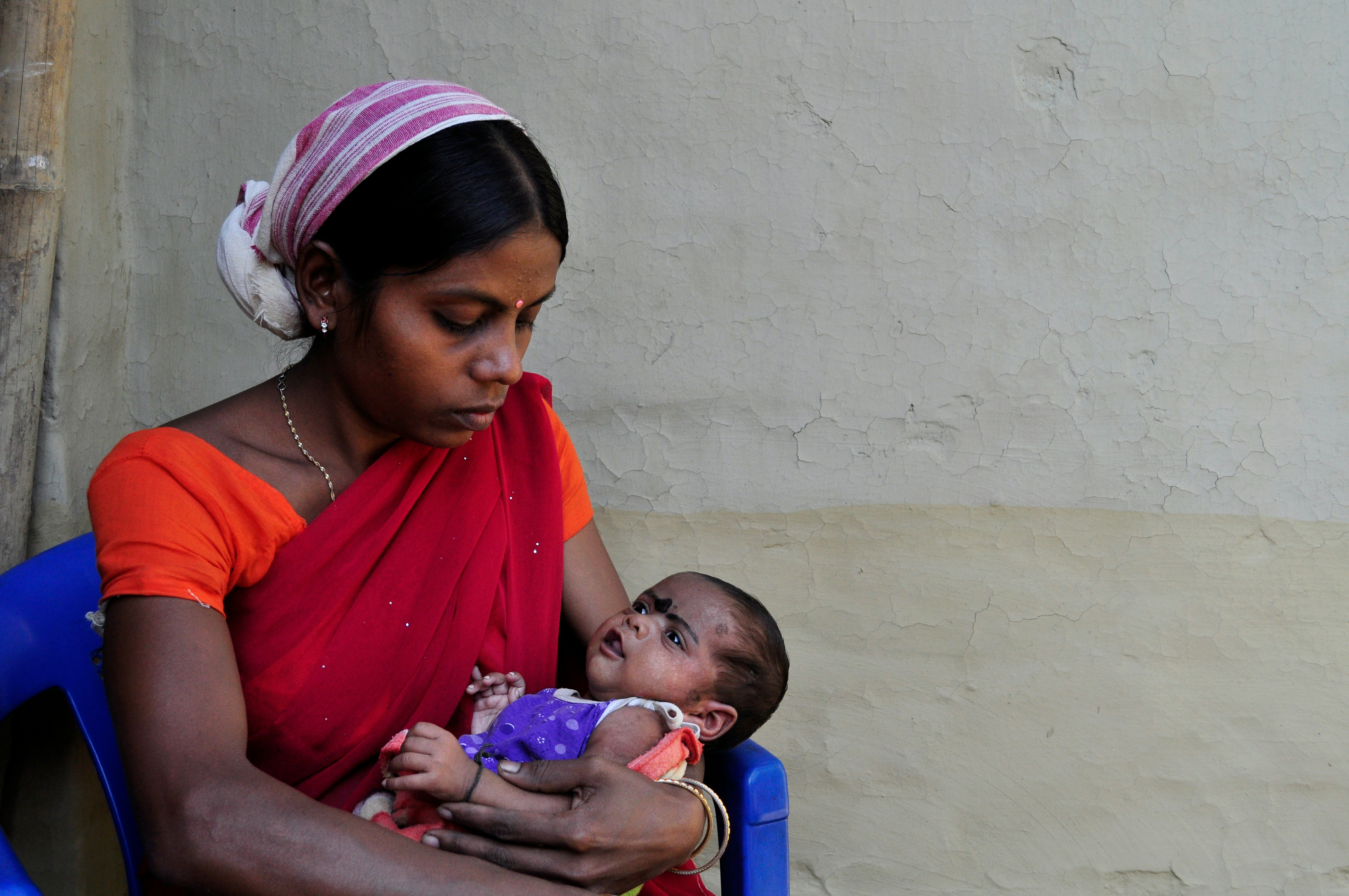 Indian mother holding baby